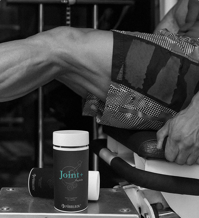Person sitting with a Joint+ supplement container on a table