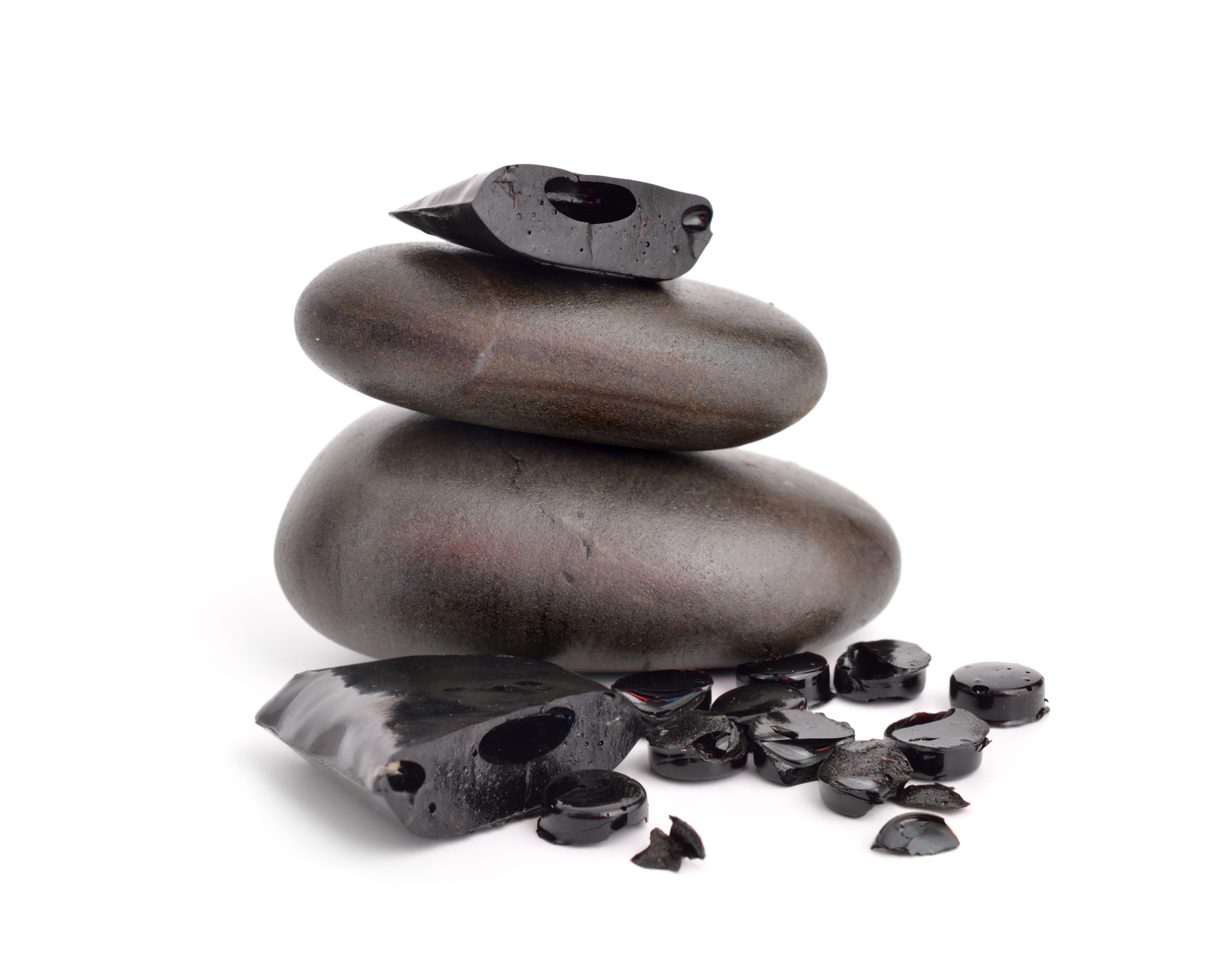 Solid shilajit rocks on top of rocks.